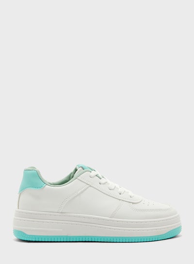 Buy Chunky Trainers In White With Green Tab in UAE