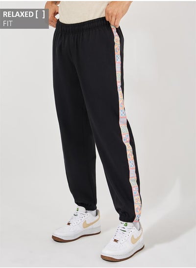 Buy Side Print Motif Relaxed Fit Joggers in Saudi Arabia