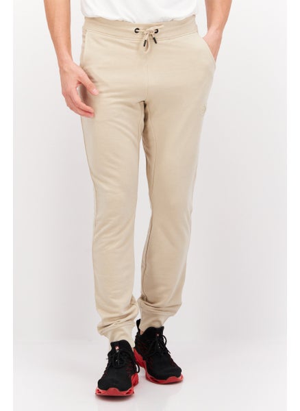 Buy Men Regular Fit Embroidered Logo Jogger Pants, Beige in Saudi Arabia