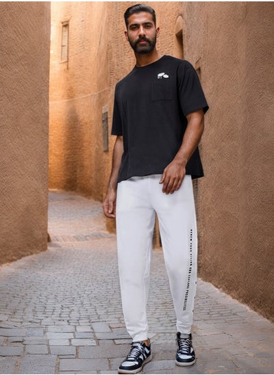 Buy Oversized Side Vertical Print and Popper Detail Joggers in Saudi Arabia