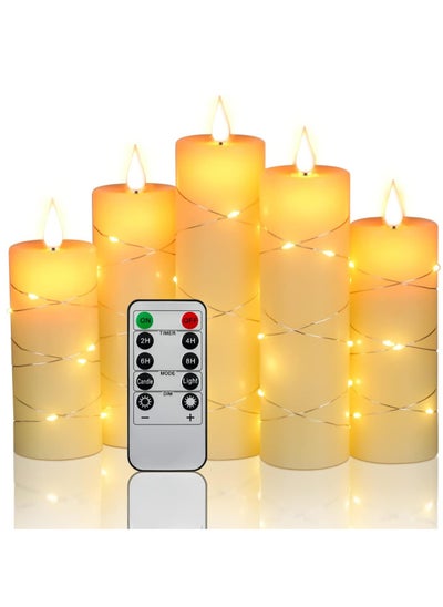 Buy Battery operated LED candles with 3D teardrop shaped wicks embedded starlight strings and a real wax pillar design presented in a 5 piece set with a remote control and timer feature for added benefit. in UAE