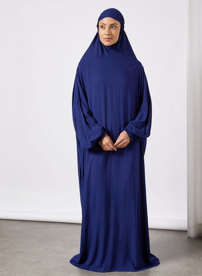 اشتري إسدال للصلاة بلون سادة مزود بحجاب متصل به في السعودية