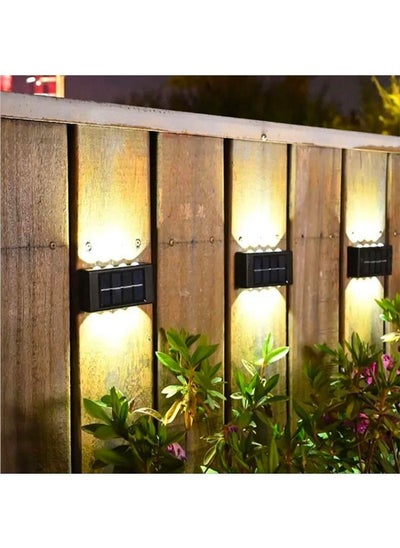 اشتري 4 Pack Solar Wall Lamp Outdoor, Waterproof Solar Powered 16 Led Light UP and Down Illuminate Home Garden Porch Yard Decoration, Warm في الامارات