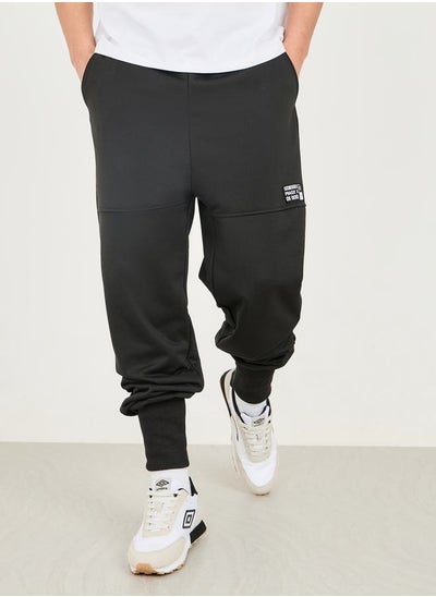 Buy Badge Detail Extra Wide Rib Cuff Low Rise Joggers in Saudi Arabia