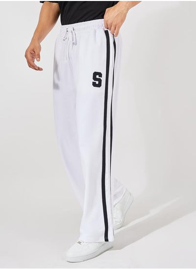 Buy Premium Side Tape Wide Leg Joggers with Embroidery Badge in Saudi Arabia