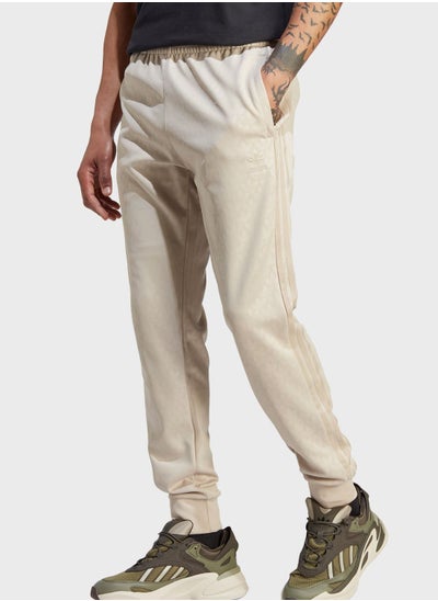 Buy Graphics Monogram Sst Track Pants in UAE