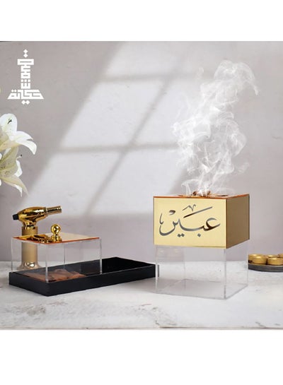 Buy An incense burner with an elegant design, made of transparent and golden acrylic, with an Arabic name in Saudi Arabia