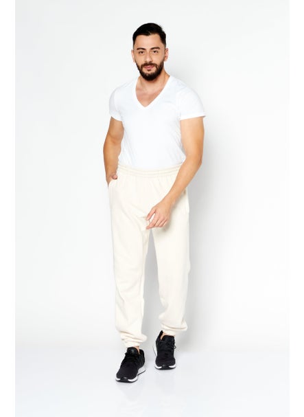 Buy Men Sportwear Fit Plain Training Jogger Pants, Cream in UAE