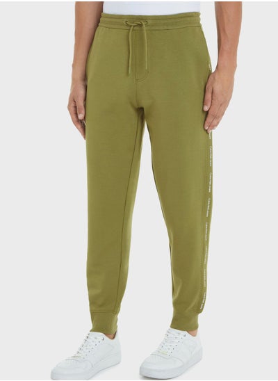 Buy Logo Repeat Sweatpants in UAE