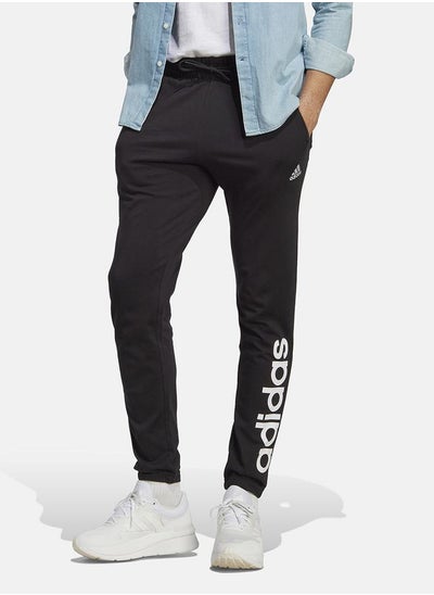 Buy Essentials Single Jersey Tapered Elasticized Cuff Logo Joggers in Saudi Arabia