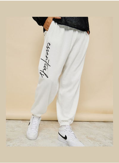 Buy Slogan Print Oversized Jogger with Slip Pocket in Saudi Arabia