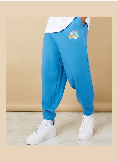 Buy Oversized Graphic Badge Print Jogger in Saudi Arabia