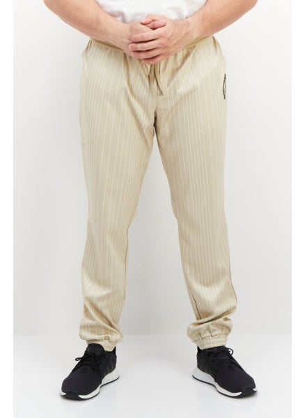 Buy Men Sportswear Fit Brand Logo Training Sweatpant, Beige in Saudi Arabia