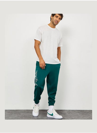 Buy Slogan Print Oversized Fit Jogger with Slip Pocket in Saudi Arabia