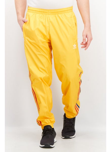 اشتري Men Sportswear Fit Training Track Pants, Gold Combo في الامارات