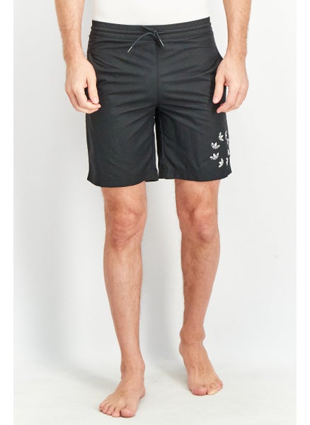 اشتري Men Sportswear Fit Adicolor Shattered Trefoil Swim Shorts, black في السعودية