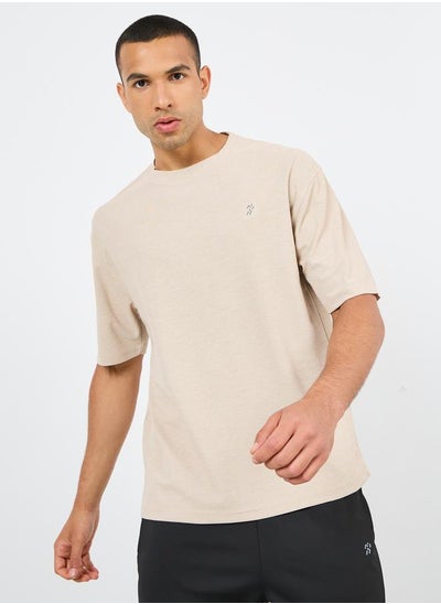 Buy Oversized Logo Print Melange Knit T-Shirt in Saudi Arabia