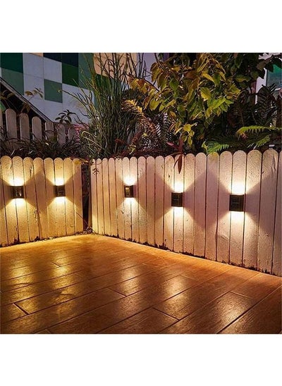 اشتري 4 Pcs Solar Fence Lights, Outdoor Lights Solar Deck Lamp Solar Wall Lamp, LED Up Down Lighting Waterproof for House Deck Step Patio, Doorway, Path, Porch, Garden Landscape Lighting, Warm في الامارات