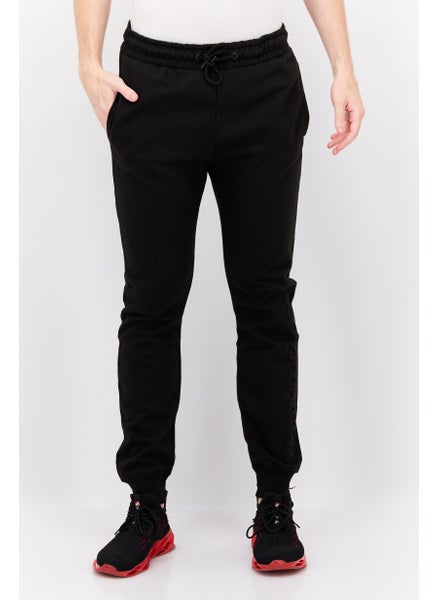 Buy Men Regular Fit Brand Logo Jogger Pants, Black in UAE