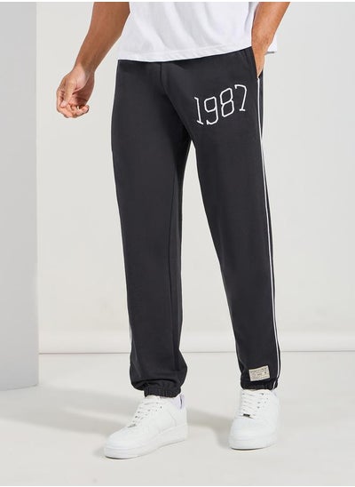 Buy Relaxed Fit Terry Jogger with Piping Detail in Saudi Arabia