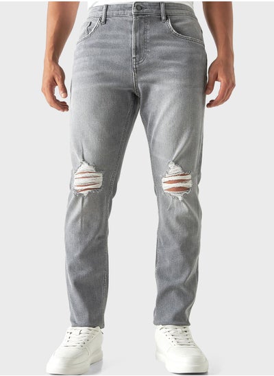 Buy Straight Fit Mid Wash Ripped Jeans in Saudi Arabia