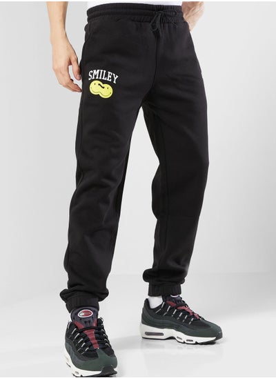 Buy Smiley Double Logo Sweatpants in UAE