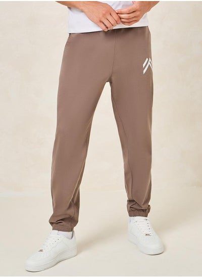 Buy Minimal Print Oversized Joggers with Elasticated Hem in Saudi Arabia