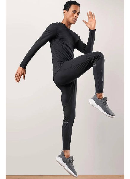 Buy Men Sportswear Fit Solid Training Thermal Tights, Black in UAE