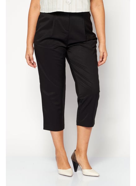 Buy Women Carrot Fit Plain Dress Pants, Black in UAE