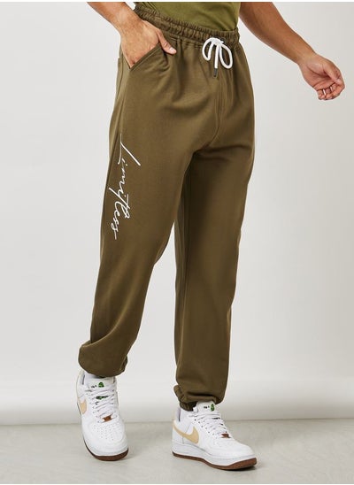 Buy Slogan Print Oversized Jogger with Drawcord Detail in Saudi Arabia