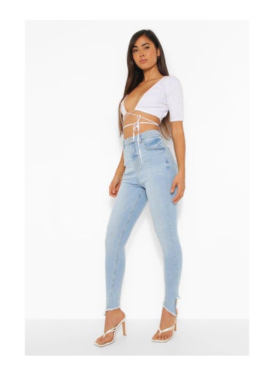 Buy Distressed Asymmetric Hem Skinny Jeans in UAE