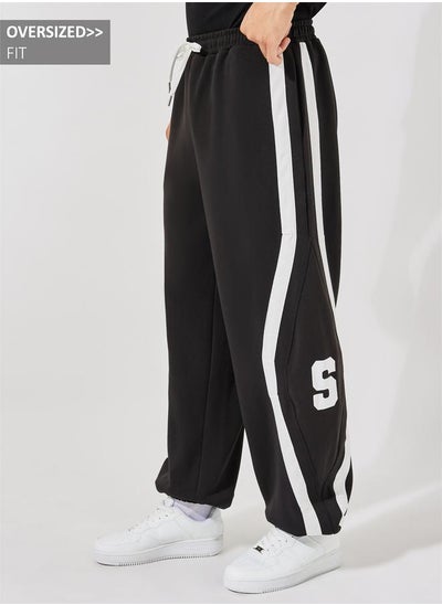 اشتري Premium Scuba Knit Oversized Joggers with Cut & Sew Contrast Tape في السعودية