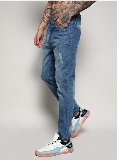 Buy Light Distressed Tapered Jeans in Saudi Arabia