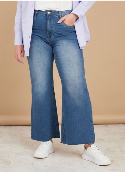 Buy High Rise Frayed Hem Flared Jeans in Saudi Arabia