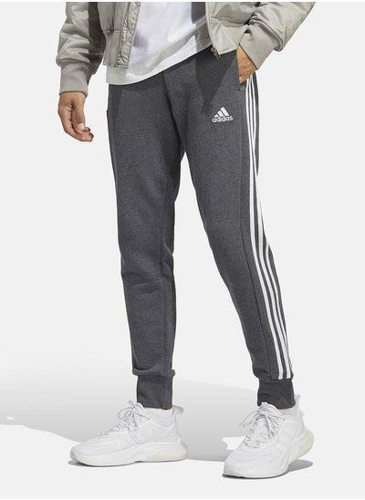 Buy Essentials French Terry Tapered Cuff 3-Stripes Joggers in Saudi Arabia