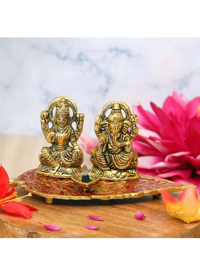 Buy Metal Laxmi Ganesha On A Leaf Diya, Golden And Red, 7.5 Inch in Saudi Arabia