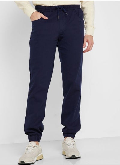 Buy Men Navy Blue Joggers Trousers in Saudi Arabia