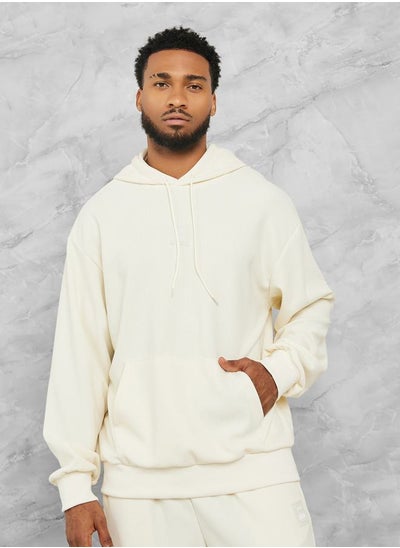 Buy Textured Chest Badge Detail Hoodie in Saudi Arabia