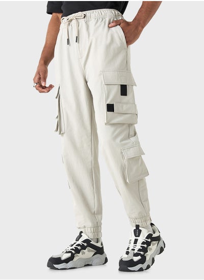 Buy Solid Relaxed Fit Cargo Pants with Drawstring Clos in UAE