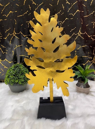 Buy Decoration in the form of a golden cedar tree with a black base in Saudi Arabia