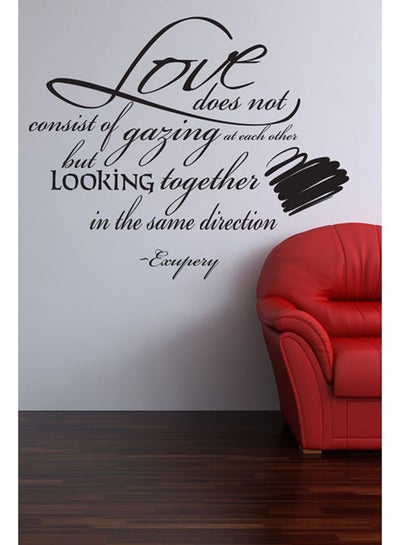 Buy Love Does Not Consist Of Gazing At Each Other But Wall Sticker Decal Black 50x41cm in UAE