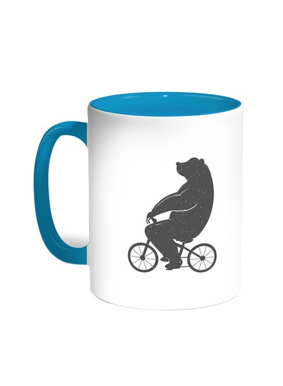 Buy Bear Driving A Bicycle Printed Coffee Mug Turquoise/White in Egypt