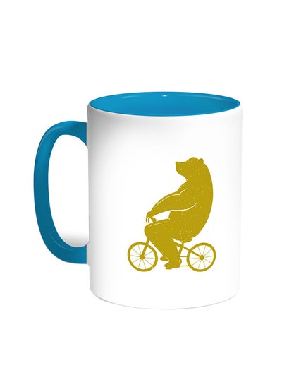 Buy Bear Driving A Bicycle Printed Coffee Mug Turquoise/White in Egypt