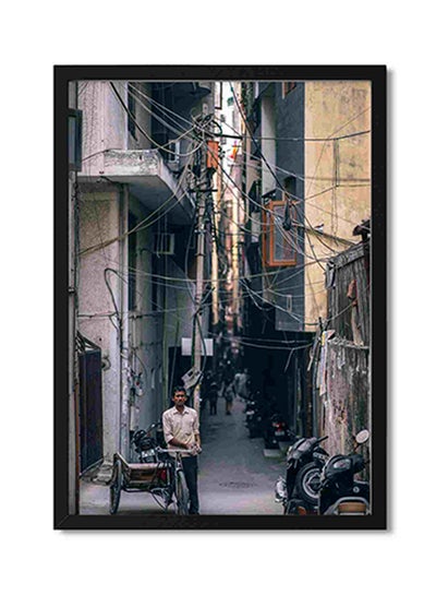 Buy Man Standing Beside Trike Wall Art Painting Multicolour 32x22x2cm in Saudi Arabia