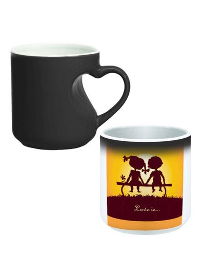 Buy Love Is Printed Magic Coffee Mug White/Brown/Yellow in Egypt