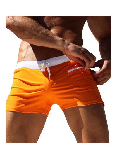 Buy Men Solid Colour Swimming Trunks Drawstring Pocket Slim Fit Beach Shorts Swimwear Orange in Saudi Arabia