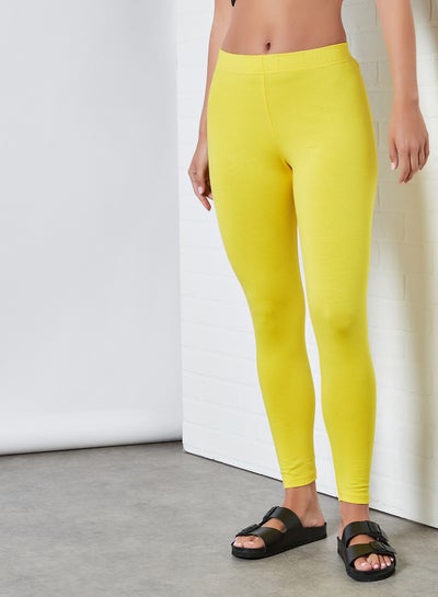 Buy Elastic Waist Mid-Rise Skinny Fit Plain Leggings Yellow in UAE