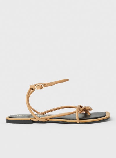 Buy Strappy Leather Flat Sandals Beige in Saudi Arabia