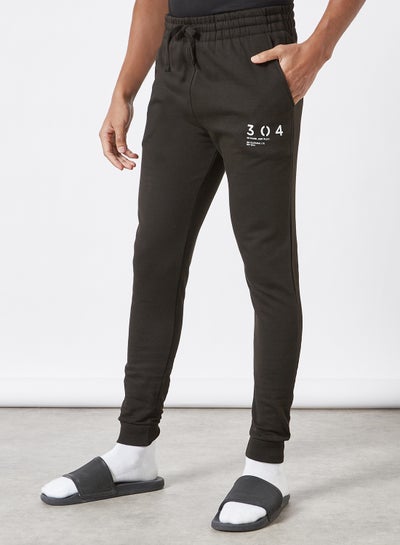 Buy Stamp Print Joggers Black in UAE