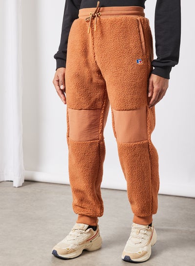 Buy Reginald Sherpa Sweatpants Pale Orange in UAE